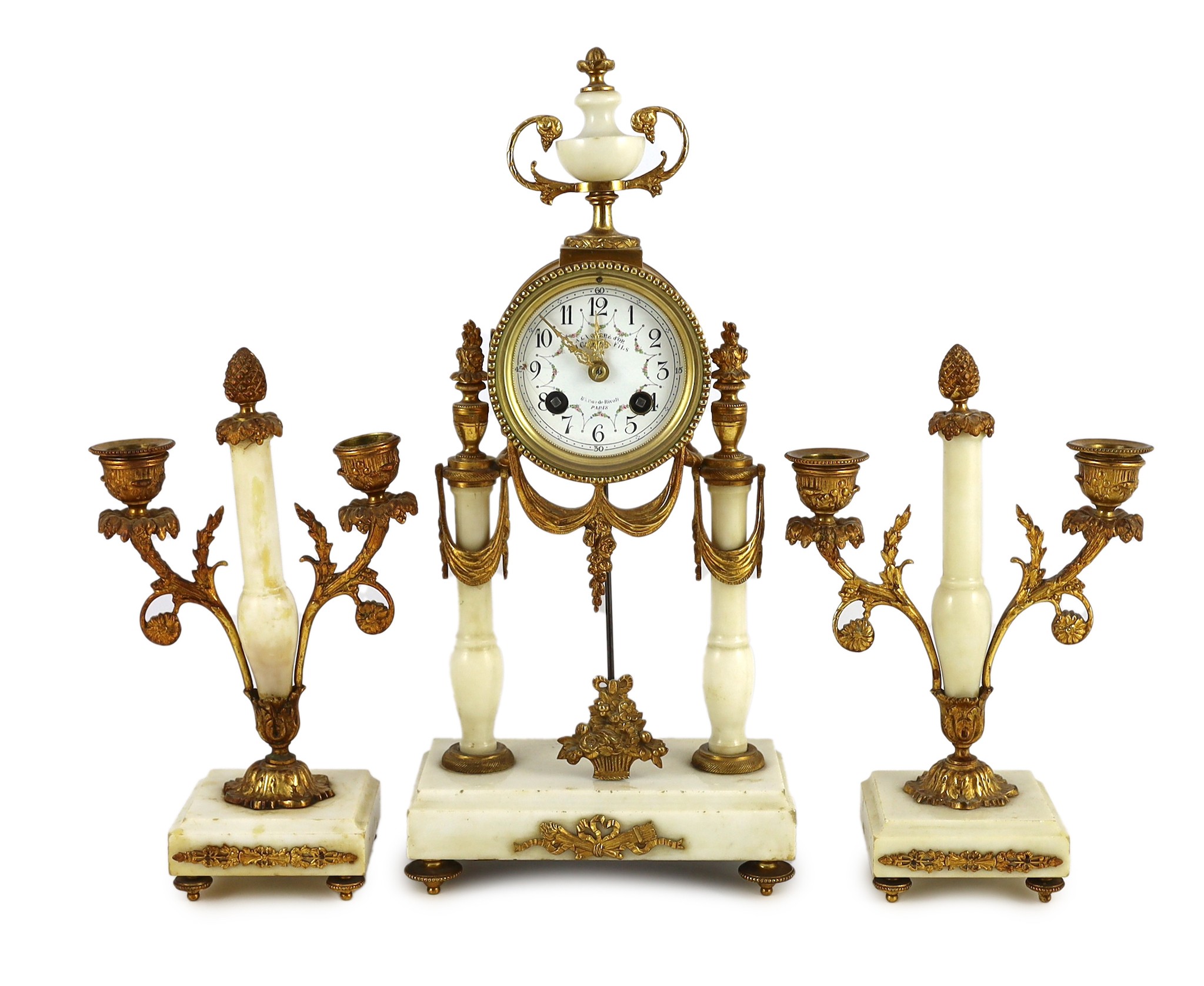 A Louis XVI style ormolu mounted white marble eight day mantel clock and a matching pair of twin branch candelabra. 38.5cm tall